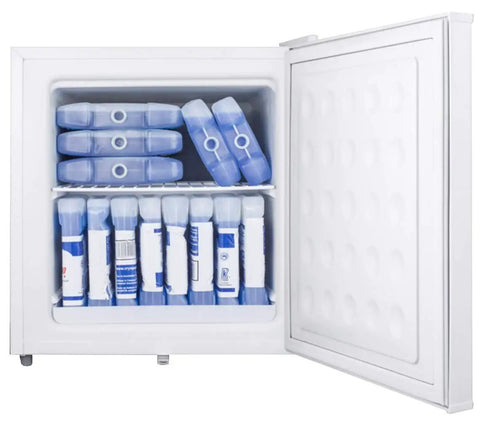 1.4 Cu Ft Compact All Freezer In Crisp White Offering No Fuss Manual Defrost And Relentless Subzero Chill To Keep Your Goods Locked Up Cold Perfect Low Key Setup For Small Kitchens And Apartments filled with ice packs.