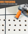 Close-up of orange diamond core drill bit creating clean holes in tile, part of Ultimate Diamond Core Drill Bit Kit Pro Grade