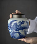 Solid Ceramic Tea Canister For Loose Leaf Storage, Airtight Kitchen Jar to keep coffee beans with a blue floral design.