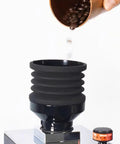 Premium Coffee Grinder Single Dose Funnel With Compact Air Blower And Durable Silicone Bean Hopper pouring beans.