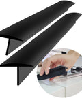 Extra Long 30 Inch Silicone Stove Gap Filler That Stays Put Fits 0.2 To 1 Inch Gaps Thick 10oz Insert Kitchen Gap Cover For 21 And 25 Inch Counters Black Set Of 2, shown in use between stove and counter.