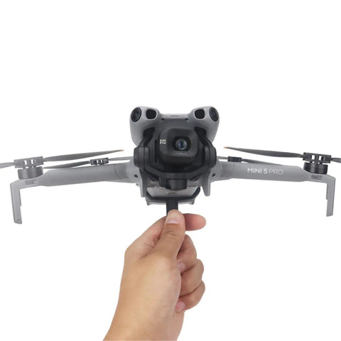 Person holding Grab And Go Handheld Drone Mount For DJI Mini 5 Pro, demonstrating seamless one take aerial to ground shooting capability.