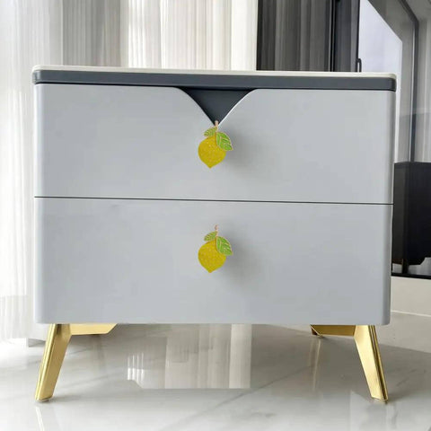 Gotta Grab These Sick Solid Zinc Lemon Drawer Knobs Fresh Citrus Cabinet Handles on contemporary dresser with gold legs.