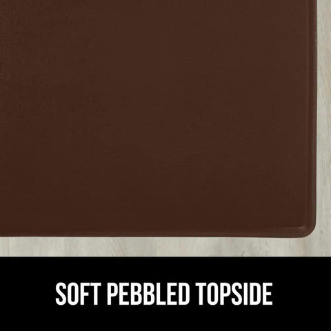 Soft pebbled surface of the 2 Pack Cushioned Kitchen Floor Mats For Comfortable Standing 17x24 And 17x48 Waterproof And Stain Resistant One Half Inch Thick Soft Ergonomic Anti Fatigue Mat With Foam Support For Feet Brown.