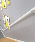 Straight Shooting Matte Black Pipe Handrail With Vintage Industrial Look And Rock Solid Wrought Iron Frame For Indoor Outdoor Steps Featuring No Sweat Custom Mounting And Durable Slip Resistant Grip on stairs.