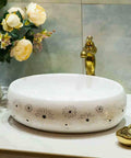 Slick Ceramic Oval Vessel Sink For Modern Bathroom Counters with floral design on smooth glazed finish.