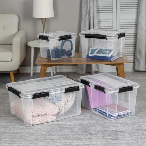 Built Like A Tank 34 Quart Gasket Storage Boxes With Lids stacked in living room, storing blankets, books, and headphones.
