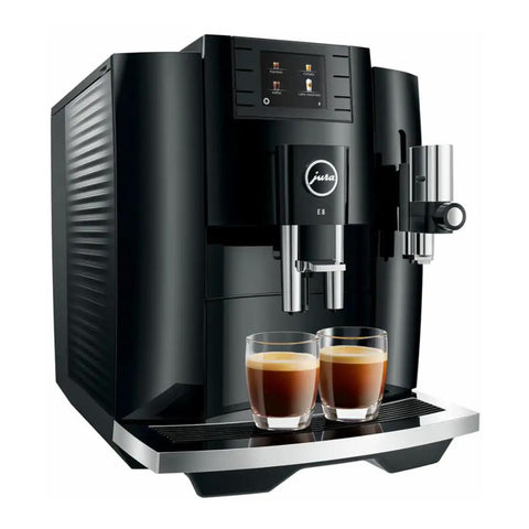 Next Level 5th Gen Automatic Smart Coffee Machine Bundle Featuring Piano Black Finish Plus Matching Glass Milk Frothing Container For Hella Smooth Lattes Bold Espresso And Quick Cappuccino Prep with two espresso shots in glasses.