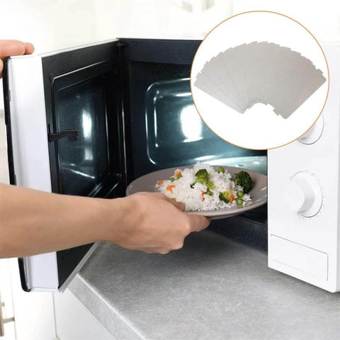 Microwave with food inside featuring an inset of a microwave waveguide cover made from mica sheet for insulation and oil stain protection.