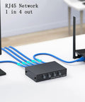 Bi Directional 4 Port Ethernet Switch with 1 Input 4 Outputs, connected to computer and router, RJ45 cables in home office setup.