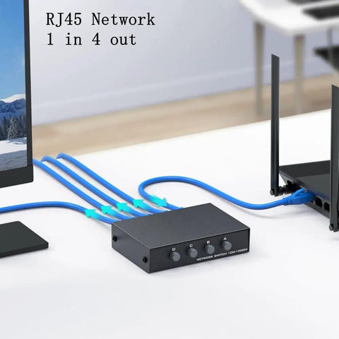 Bi Directional 4 Port Ethernet Switch with 1 Input 4 Outputs, connected to computer and router, RJ45 cables in home office setup.