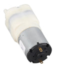 Rock Solid Mini Micro Air Vacuum Pump Running Next Level Quiet With Low Voltage Safety Design Knockout High Performance And Compact Durability in white and silver with a plastic body.