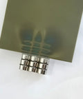 4x6 Inch Magnetic Field Viewing Film With Green Visual Aid displaying magnetic flux patterns with steel rings underneath