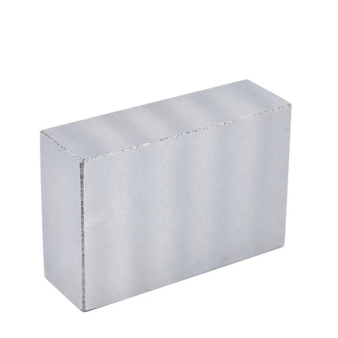 Front view of a silver 1x2x3 hardened steel machinist milling block.