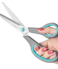 Four Piece Scissors Set With Premium Stainless Steel Blades And Ergonomic Semi Soft Rubber Grip in gray and blue, in hand