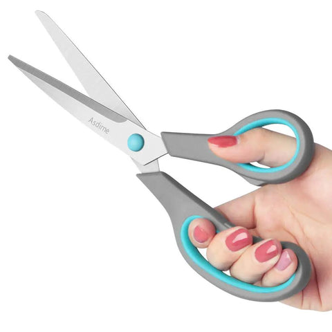 Four Piece Scissors Set With Premium Stainless Steel Blades And Ergonomic Semi Soft Rubber Grip in gray and blue, in hand
