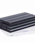 Front view of six black neodymium bar magnets with epoxy coating and adhesive, 60 × 10 × 3 mm, 12-pack