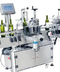 Slick Automatic Desktop Labeler For Cosmetic Jars And Bottles Featuring Straight Up Precision And Zero Fuss Operation To Deliver Badass Quality Seals on a metallic labeling machine with green bottles.