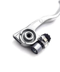 Close-up of CNC aluminum hydraulic clutch lever and master cylinder for KTM dirt bikes, smooth action, pro grade durability.