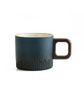 Gotta Love This Ceramic Espresso Cup With A Natural Wood Handle Kickin Up Your Daily Brew Routine While Keeping Things Cool To Touch And Looking Sharp On Any Counter Space. Compact dark blue ceramic cup with a unique wooden handle.