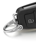 Silver key ring attached to a car key, featuring Six Pieces D Shape Key Ring Shackles With Screw Shackle In Black Silver Gold for easy access.