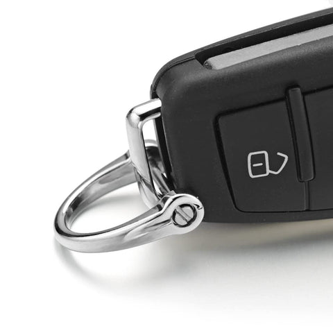Silver key ring attached to a car key, featuring Six Pieces D Shape Key Ring Shackles With Screw Shackle In Black Silver Gold for easy access.