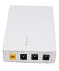 Portable DC UPS Backup Power Supply With 6000mAh Battery, white power unit with multiple input/output ports.