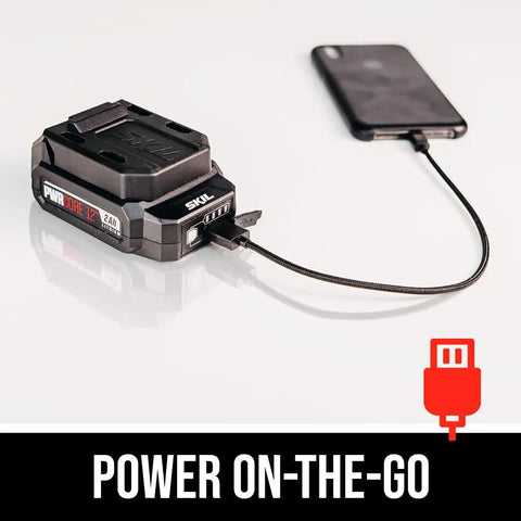 Badass Brushless 12 Volt Reciprocating Saw Kit With Quick Charge Battery connected to a smartphone for charging.