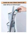 Hand placing socks into Double Sided Hanging Closet Organizer With Thirty Roomy Pockets In Gray, designed to maximize storage.