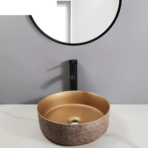 UMJIGF Bathroom Countertop Vessel Sink Bathroom Vessel Sink Bathroom Light Luxury Ceramic Basin round ceramic art basin displayed on marble countertop.