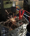 SFX EDM-8C 800W portable EDM tap burner; front view with sparks removing a broken tap from a metal block.