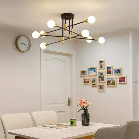 Mid Century Modern Chandelier Ceiling Light Fixture With Black And Gold Finish over dining table, adjustable arms