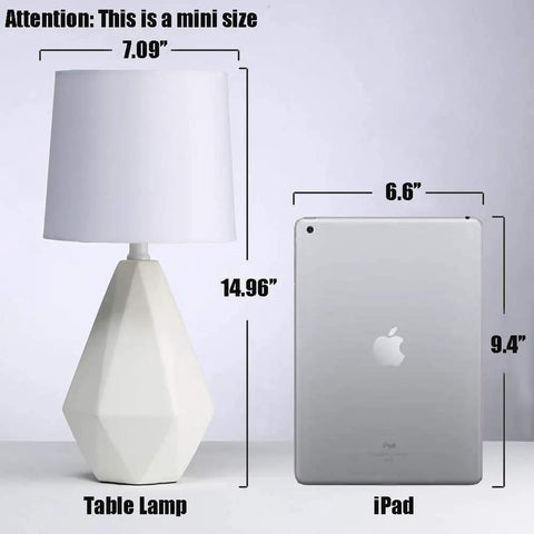 Modern White Ceramic Table Lamp With Irregular Geometric Base And White Fabric Shade Compact Nightstand Bedside Lamp For Bedroom Living Room Or Office 15 Inch Tall 7 Inch Diameter Sleek Decor Accent next to an iPad for size comparison