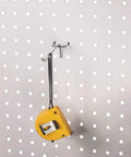 30-Piece 4 Inch Silver Pegboard Hooks Set For 1/4 Inch And 1/8 Inch Pegboards Garage Tool Shed Or Basement Organization Kit Heavy Duty Durable Hooks For Hangers Tools Cords And More holding a yellow tape measure on a pegboard