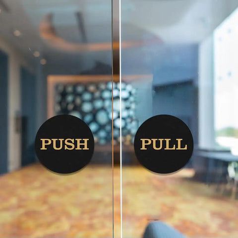 Two Inch Round Push Pull Door Signs Brushed Gold Set Of Two Durable Plastic With Strong Adhesive Foam Tape For Super Easy Install And Clear Legible Messaging In Offices Homes Or Commercial Doors on glass door