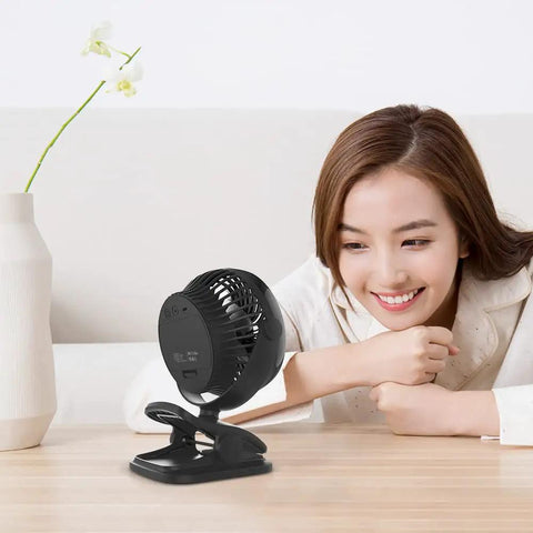 Clip On 5 Inch Fan With Aroma Function, AA Battery Operated Or USB Powered, 4 speed portable desk fan on a table