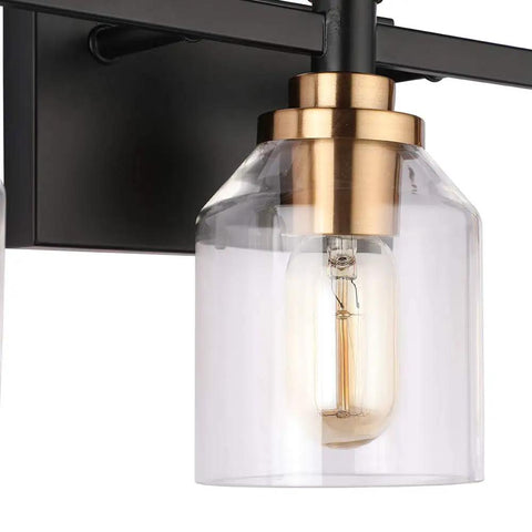 Close-up of the Three Light Industrial Bathroom Vanity Sconce With Black Gold Finish matte black base and clear glass shade.