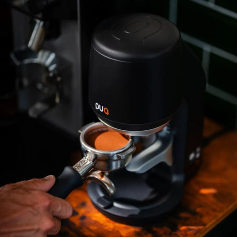 Image of Automatic Espresso Tamper 54.3mm Self Leveling Coffee Press in action, showcasing coffee puck in portafilter.