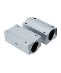 Badass Grip Heavy Duty Linear Motion Ball Bearings Aluminum Slide Bushing Blocks For CNC Rigs And 3D Printers Smooth Rolling Guide Rails showing two aluminum slide blocks.