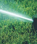 Gear Drive Sprinklers Are A Total Game Changer For Patchy Lawns, multi rotor head spraying water in lawn.