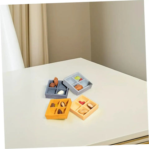 Four Grid Miniature Resin Storage Box Set For Dollhouses And Fairy Gardens with candy and nut ornaments on table