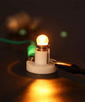 Glowing bulb from Kids DIY DC Motor Kit With 131 Pieces And 66 Gears Six Pack Bundle for STEM projects
