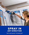 User applying Portable Cordless Drill Connect Paint Sprayer Featuring A Compact Application Cup And High Pressure Output for indoor wood staining.