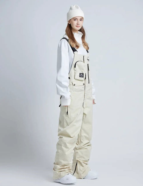 Person wearing Unisex Ski Bibs Waterproof Snow Overalls Warm Insulated Windproof Snowboarding Pants For Men And Women Outdoor Cold