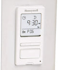 Programmable Timer Switch For Incandescent And Halogen Lighting With 40 To 500 Watts 120 Volt 60 Hz Power, front view on wall