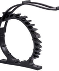 Black rubber clamp ring for mounting tools, circular frame with toothed inner surface, base feet, fits 2.5-7.5 in diameter
