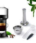 Refillable Vertuo Next Coffee Capsule Pro Grade Set With Stainless Steel Cap Reusable Pods For 230ml Crema VertuoLine Compatible 1 Capsule And Tamper Included BPA Free Stainless Steel against leaves and coffee machine background