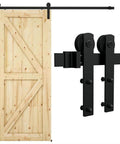 6.6 Foot Sliding Barn Door Hardware Kit For One Wood Door Delivers Smooth Quiet Operation No Sweat Easy Install Fits 35 To 40 Inch Wide And 1.18 To 1.96 Inch Thick Door Panels Includes Step By Step Installation Guide, showing a wooden barn door with hardware in black metal.