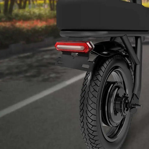Ultra Bright E Bike Taillight With Turn Signals And Brake Sensor That Lights Up instantly For Night Riding Safety On Any Scooter Or Electric Cycle mounted on rear wheel