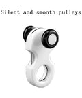 Close-up of a white plastic pulley with two black wheels, labeled 'Silent and smooth pulleys'